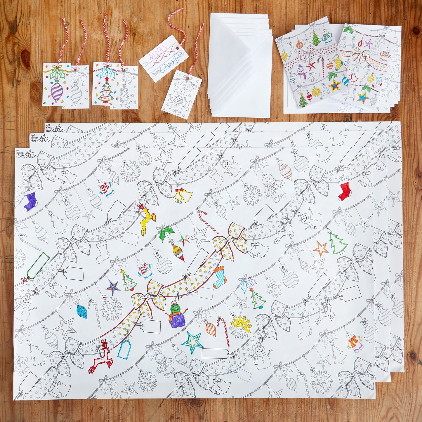 3 x Gift Wrap Paper, sizes 49cm x 71cm, 6 x  Gift Tags, sizes 8.5cm x 5.5cm and 6 x Christmas Cards sizes 14.8cm x 21cm Fabric: paper/card. Pack weight: 190g.. Each item has a festive Christmas design to colour in. 